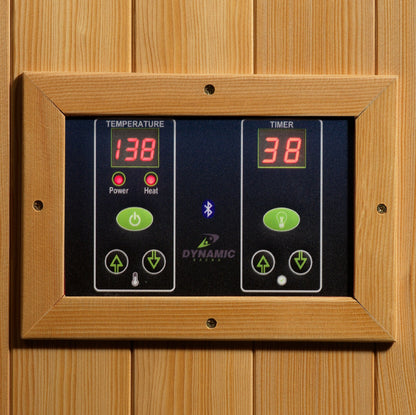 Digital control panel with temperature and timer display on a wooden background